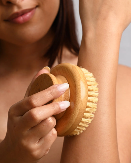 Garshana Dry Body Brush by LAMAV — close up of a woman using the brush on her arm | Stimulates circulation and lymph flow