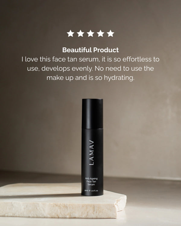 Anti-Ageing Face Tan Serum by LAMAV — bottle on a stone slab with a 5-star review | Hydrates and develops evenly