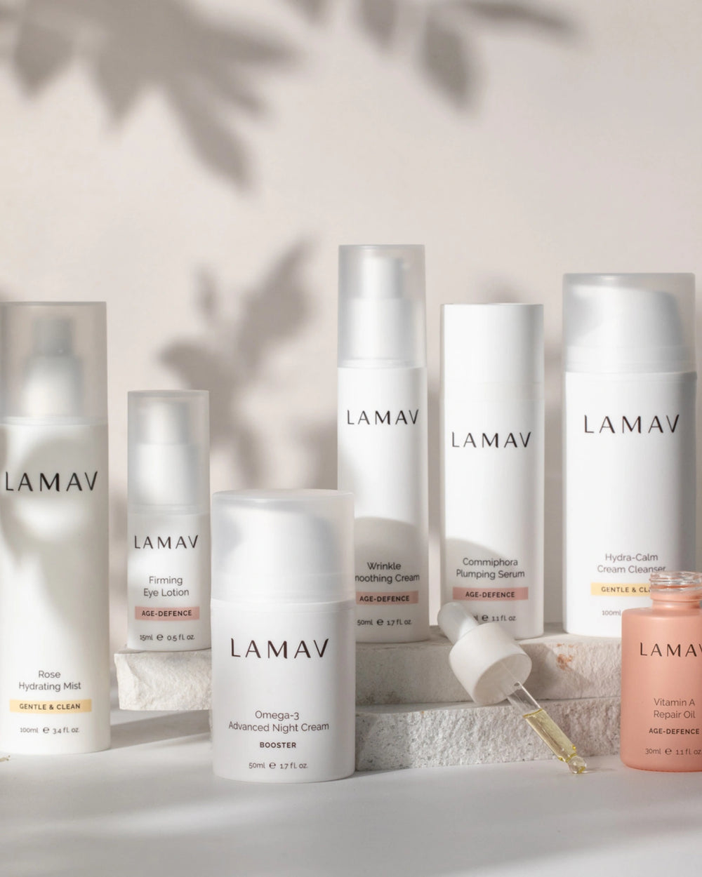 Age-Defence Complete Collection by LAMAV — 7 skincare bottles on a textured stone slab | Complete routine for sensitive skin