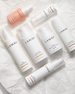 Age-Defence Complete Collection by LAMAV — 7 products lying flat on crumpled white tissue | Deeply nourish dry skin