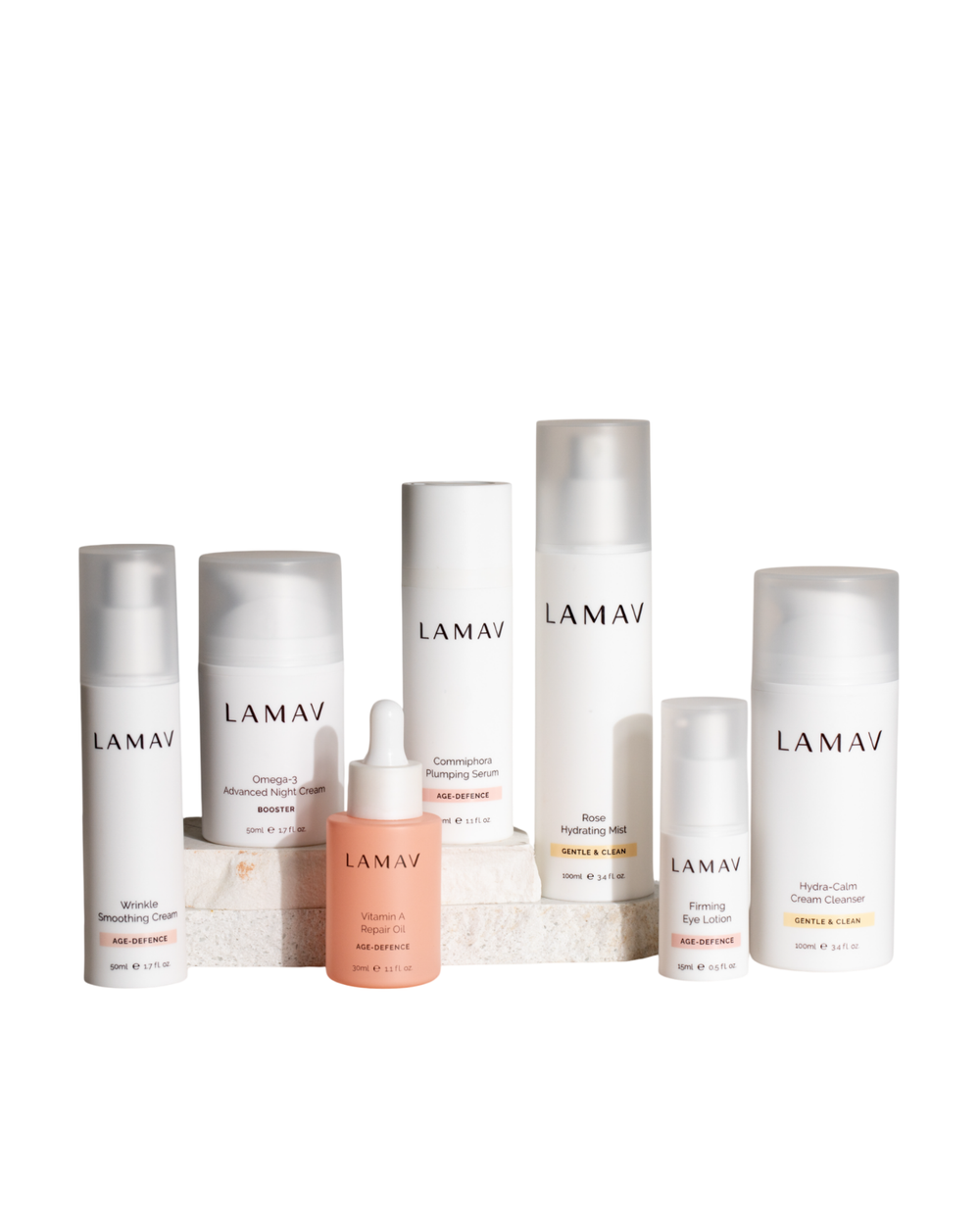Age Defence Complete Skincare Collection by LAMAV — seven anti-aging skincare bottles on a stone podium, front view | firming routine