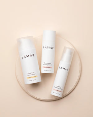 Age-Defence Essentials by LAMAV — 3 bottles lying on a round ceramic coaster | Boost collagen naturally