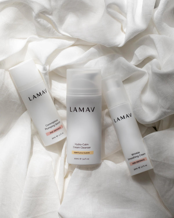 Age-Defence Essentials by LAMAV — 3 bottles resting on crumpled white linen | Soothe and hydrate aging skin