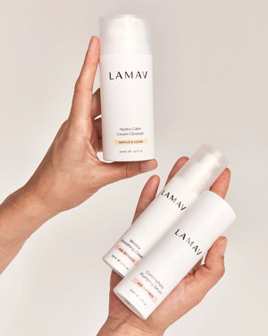 Age-Defence Essentials by LAMAV — two hands holding 3 white skincare bottles | Smooth and rejuvenate skin