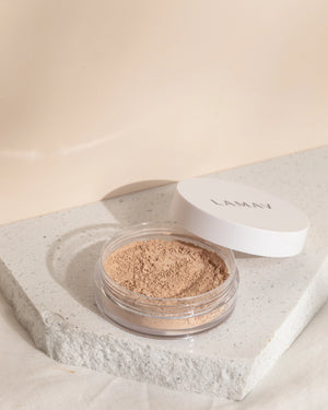 Anti-Ageing Mineral Foundation SPF15 by LAMAV — open jar of powder resting on white stone | Buildable anti-aging coverage