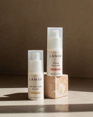 Anti Dark-Circle Eye Gel by LAMAV — bottle next to Firming Eye Lotion on a stone block | Rejuvenate the eye area