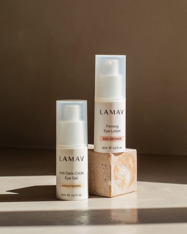 Anti Dark-Circle Eye Gel by LAMAV — bottle next to Firming Eye Lotion on a stone block | Rejuvenate the eye area