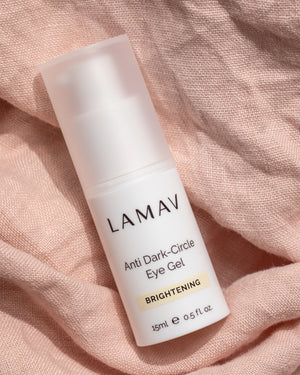 Anti Dark-Circle Eye Gel by LAMAV — 15ml bottle resting on pink textured linen | Brightens and awakens tired eyes