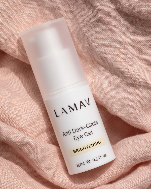 Anti Dark-Circle Eye Gel by LAMAV — 15ml bottle resting on pink textured linen | Brightens and awakens tired eyes
