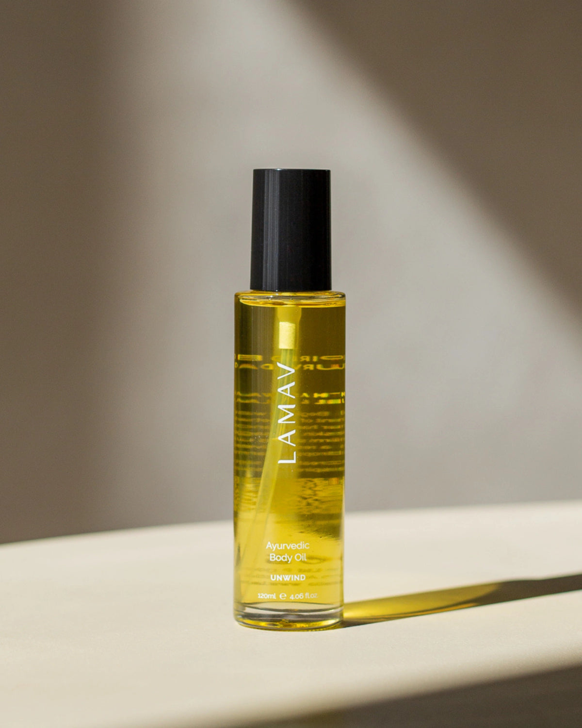 Ayurvedic Body Oil Unwind by LAMAV — 120ml glass bottle standing on a white surface | Nourish and relax your skin