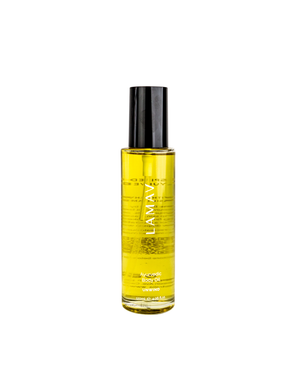 Ayurvedic Body Oil Unwind by LAMAV — yellow bottle next to a bronze beauty award | Relaxes the mind and nourishes skin