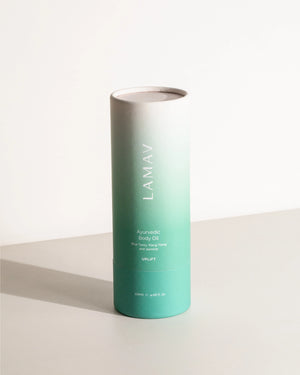Ayurvedic Body Oil Uplift by LAMAV — teal cylindrical packaging standing upright | Invigorates and brightens skin