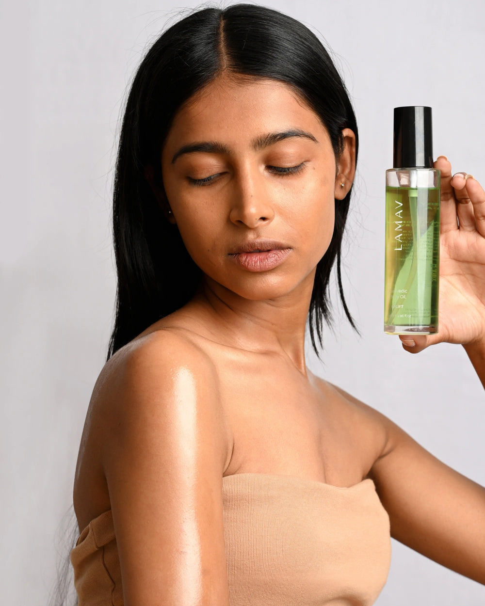 Ayurvedic Body Oil Uplift by LAMAV — green bottle next to two beauty awards | Award-winning skin nourishment