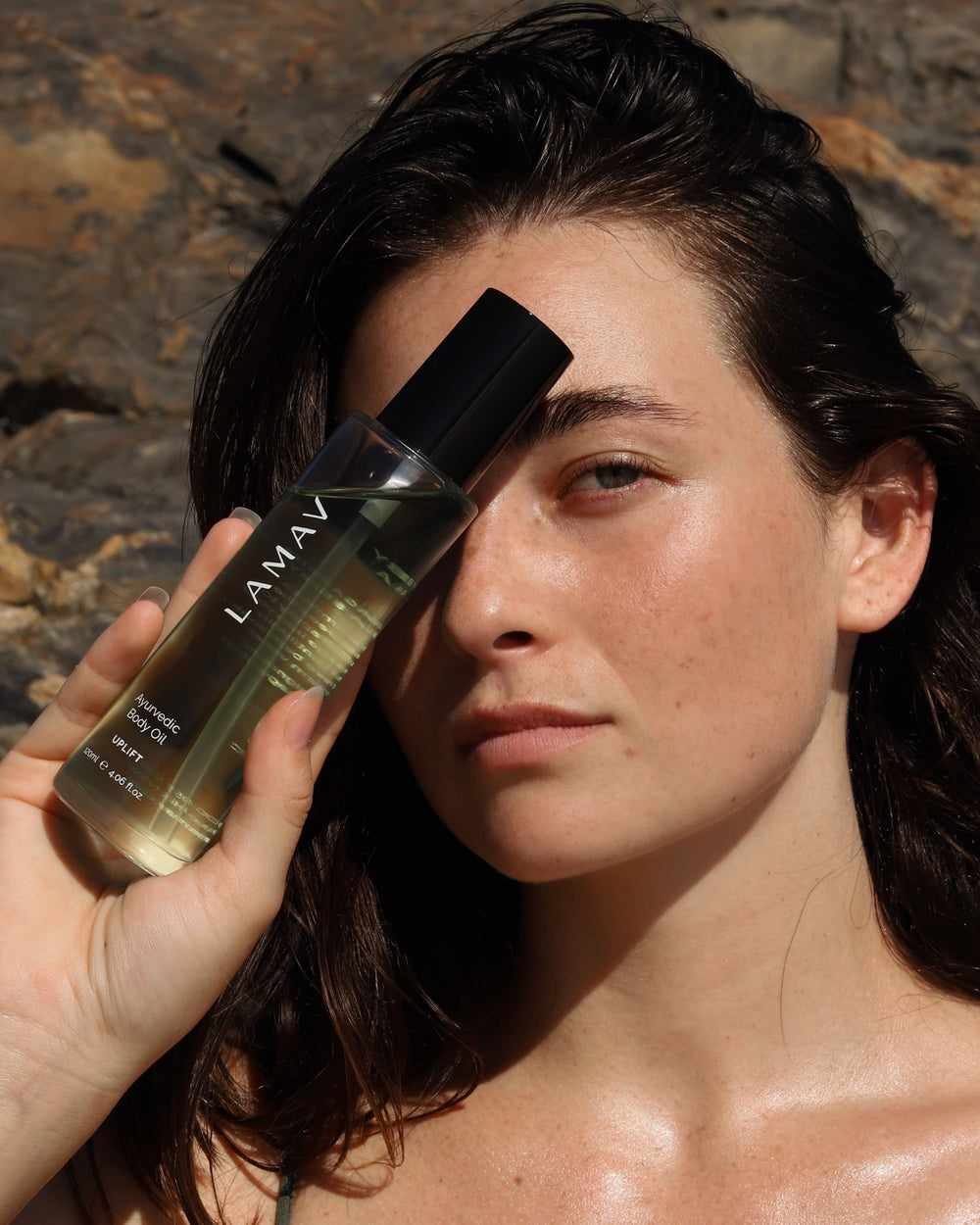 Ayurvedic Body Oil Uplift by LAMAV — green bottle next to two beauty awards | Award-winning skin nourishment