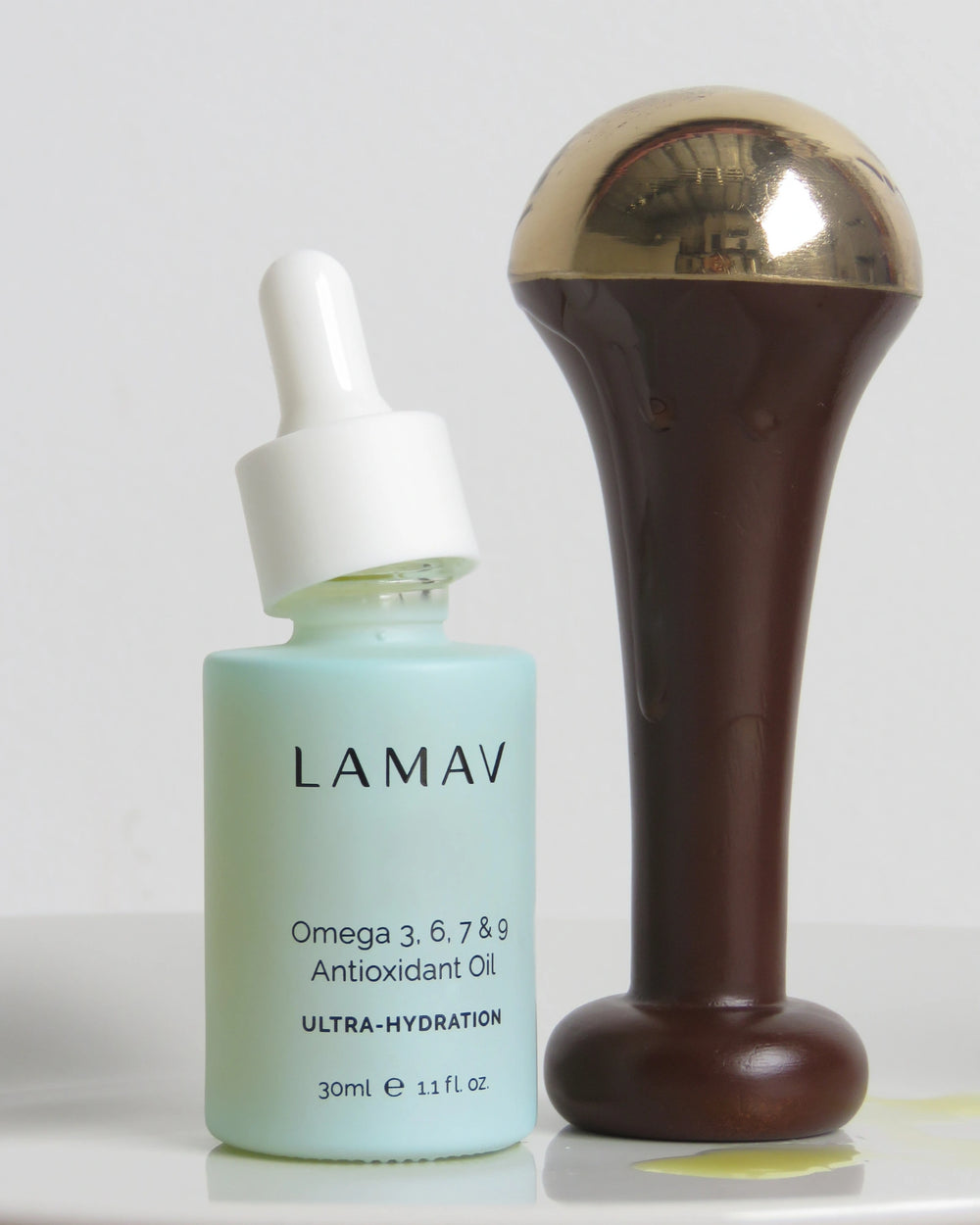 Ayurvedic Kansa Wand by LAMAV — massage tool next to two beauty awards | Award-winning facial rejuvenation