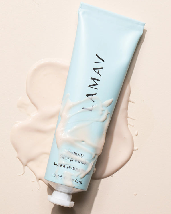 Beauty Sleep Mask by LAMAV — tube resting on a large smear of the creamy mask | Locks in moisture overnight