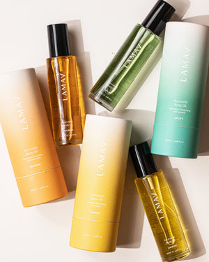 Body Oil Trio by LAMAV — three oil bottles lying flat with their colourful tube packaging | Complete organic body care