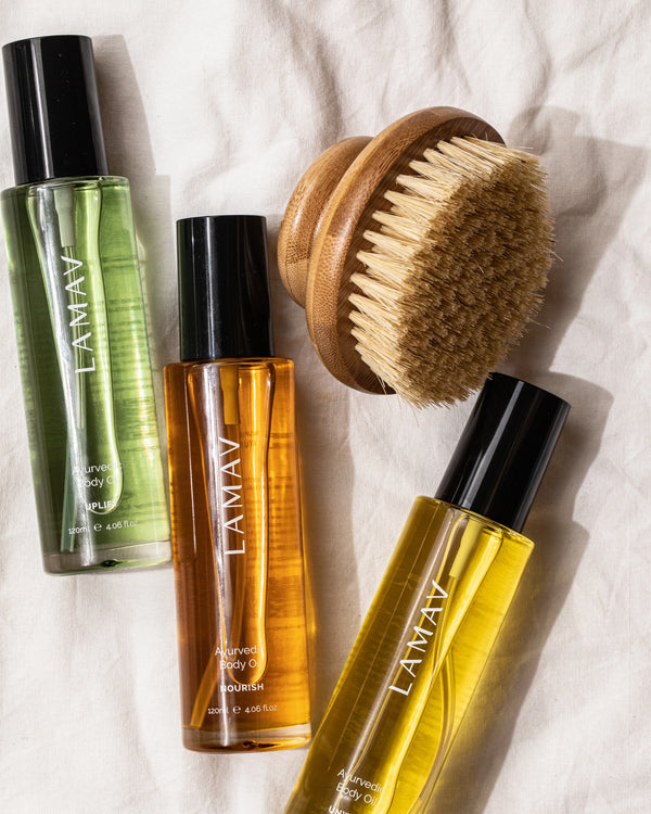 Body Oil Trio by LAMAV — three oil bottles and a wooden body brush on linen | Enhances your body care ritual