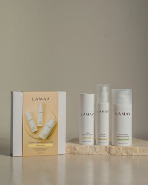 Brightening Essentials Set by LAMAV — bottles standing next to their yellow gift box | Perfect gift for glowing skin