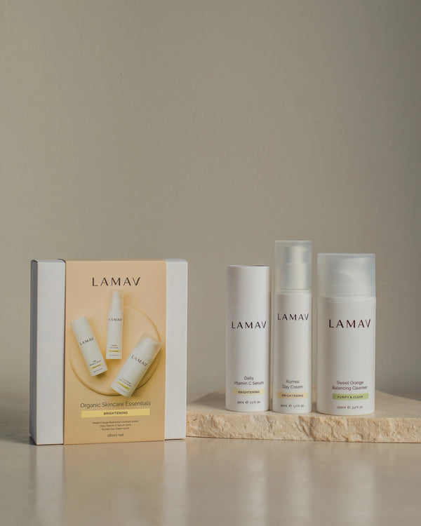 Brightening Essentials Set by LAMAV — bottles standing next to their yellow gift box | Perfect gift for glowing skin