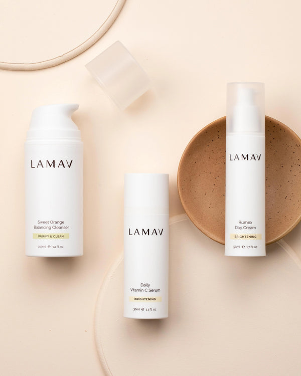 Brightening Essentials Set by LAMAV — bottles standing upright next to a brown ceramic dish | Purify and hydrate daily