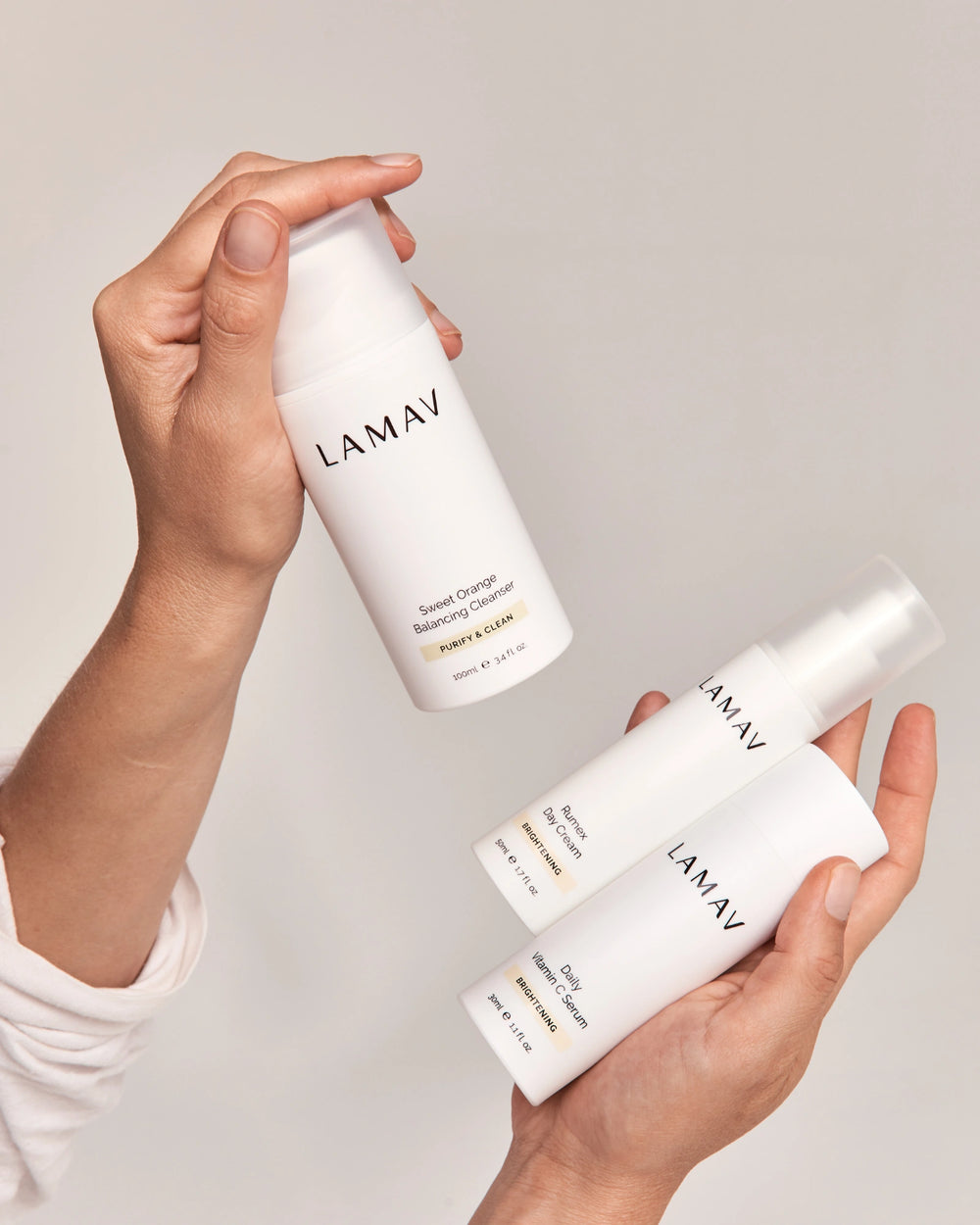Brightening Essentials Set by LAMAV — bottles standing next to their yellow gift box | Perfect gift for glowing skin