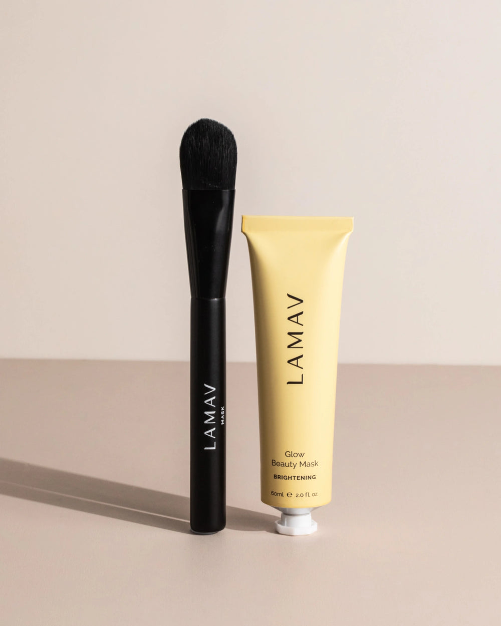 Brightening Mask Bundle by LAMAV — mask application brush next to a yellow tube | restores radiant glowing skin