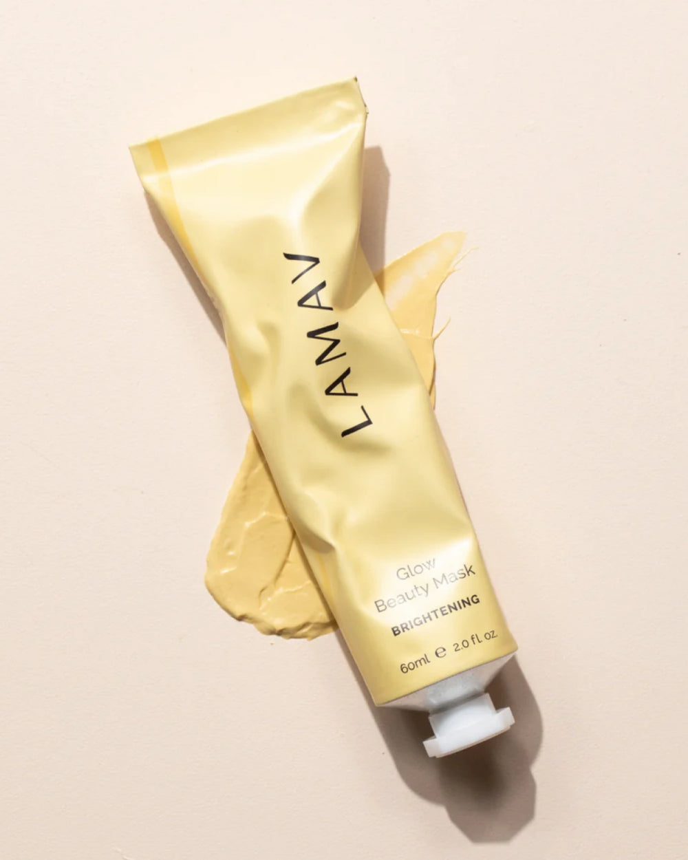 Brightening Mask Bundle by LAMAV — mask application brush next to a yellow tube | restores radiant glowing skin