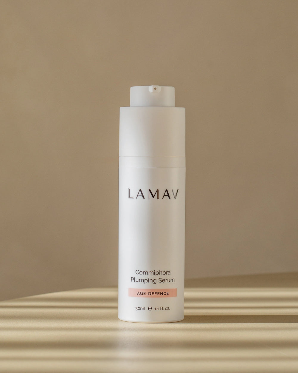 Commiphora Plumping Serum by LAMAV — white bottle with an organic beauty award badge | plumps and firms skin