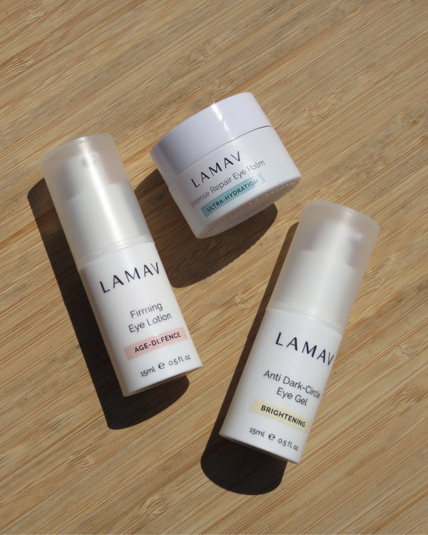 Complete Eye Care Collection by LAMAV — three products resting on a wooden bamboo surface | smooths dark circles