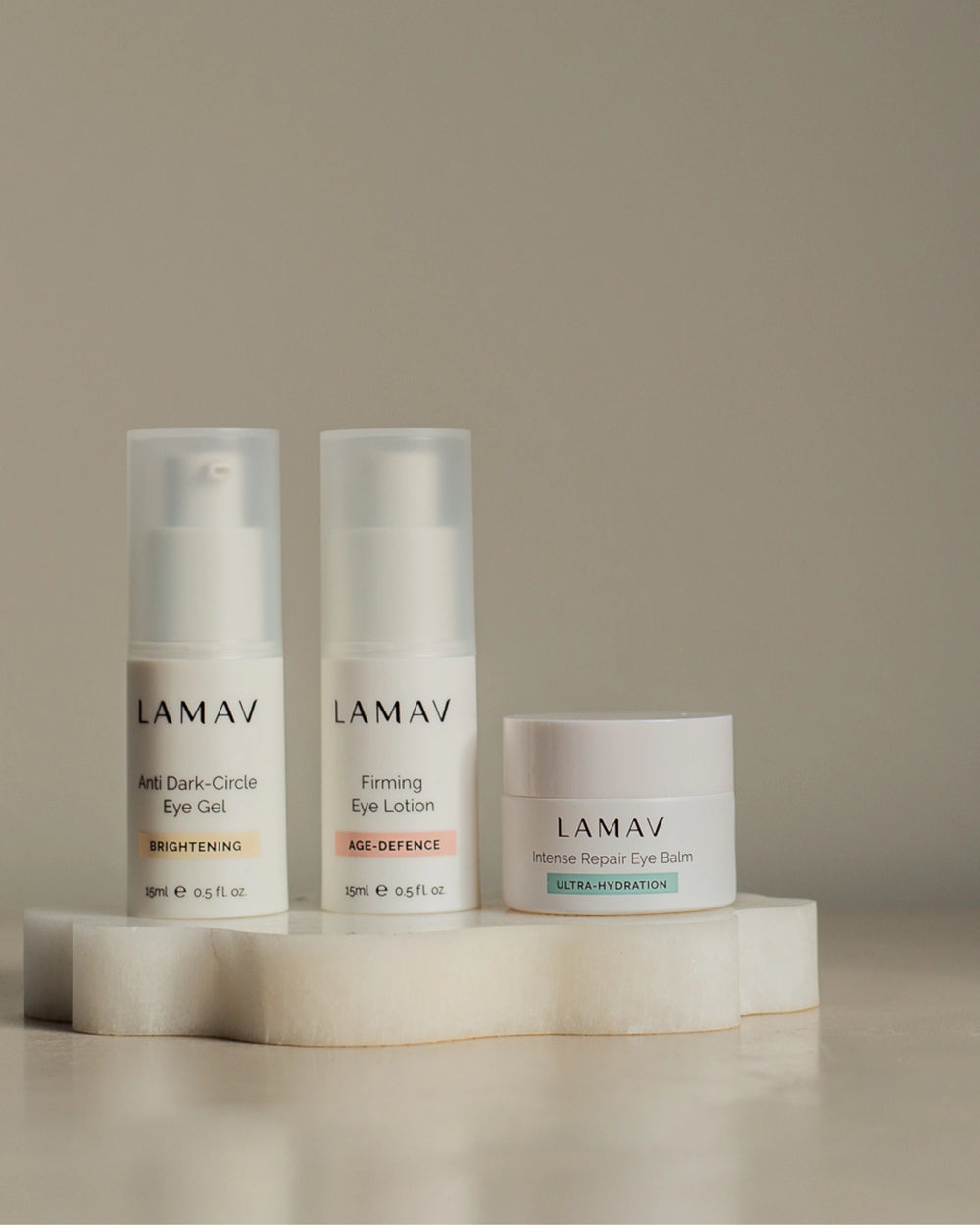 Complete Eye Care Collection by LAMAV — three eye care bottles standing on a wavy white stone | Reduce dark circles and puffiness