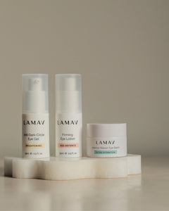 Complete Eye Care Collection by LAMAV — three eye care bottles standing on a wavy white stone | Reduce dark circles and puffiness