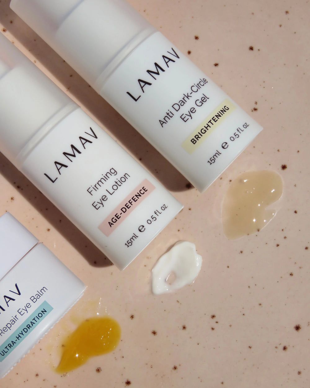 Complete Eye Care Collection by LAMAV — three eye care bottles standing on a wavy white stone | Reduce dark circles and puffiness