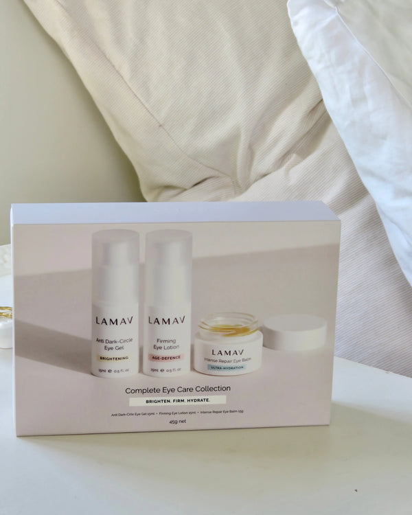 Complete Eye Care Collection by LAMAV — closed white gift box resting on white bed linens | Organic essential eye care routine