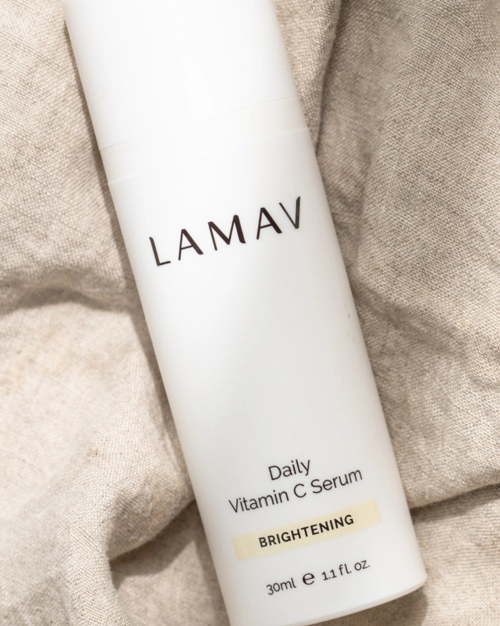 Daily Vitamin C Serum by LAMAV — white bottle with three beauty award badges | brightens and evens skin tone