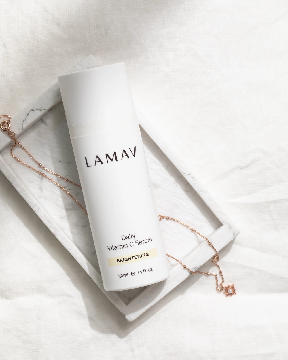 Daily Vitamin C Serum by LAMAV — white bottle with three beauty award badges | brightens and evens skin tone