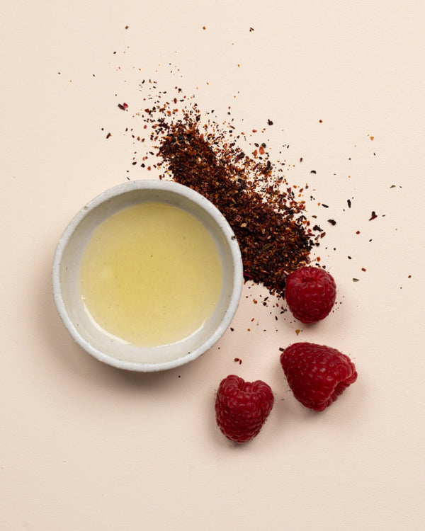 Double Cleansing Duo II by LAMAV — bowl of golden oil next to fresh raspberries | Antioxidant-rich natural ingredients