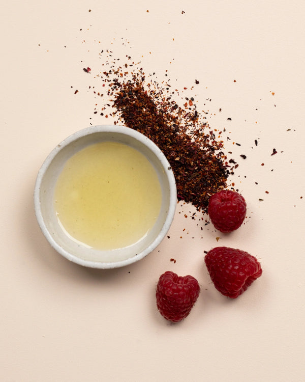 Double Cleansing Duo by LAMAV — bowl of golden oil with fresh raspberries and botanicals | Nourishing antioxidant wash