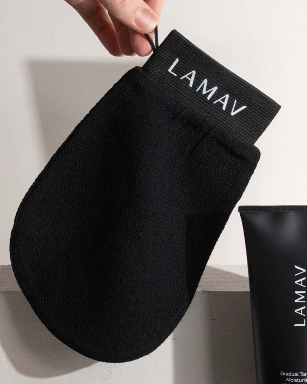 Exfoliating Mitt by LAMAV — black textured mitt isolated on a white background, front view | preps skin for self-tanning