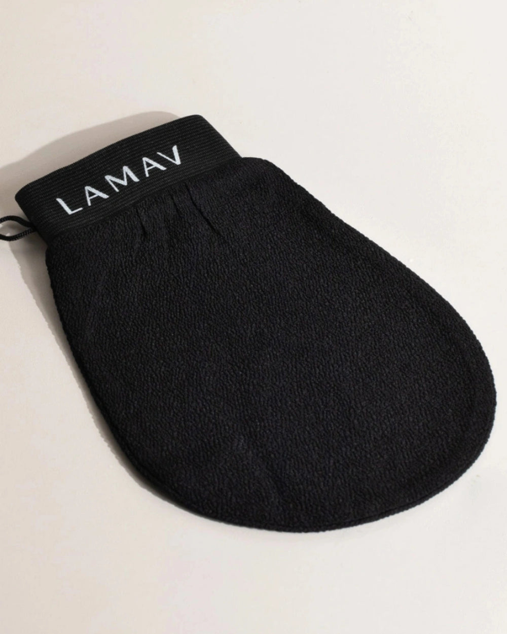 Exfoliating Mitt by LAMAV — black textured mitt isolated on a white background, front view | preps skin for self-tanning