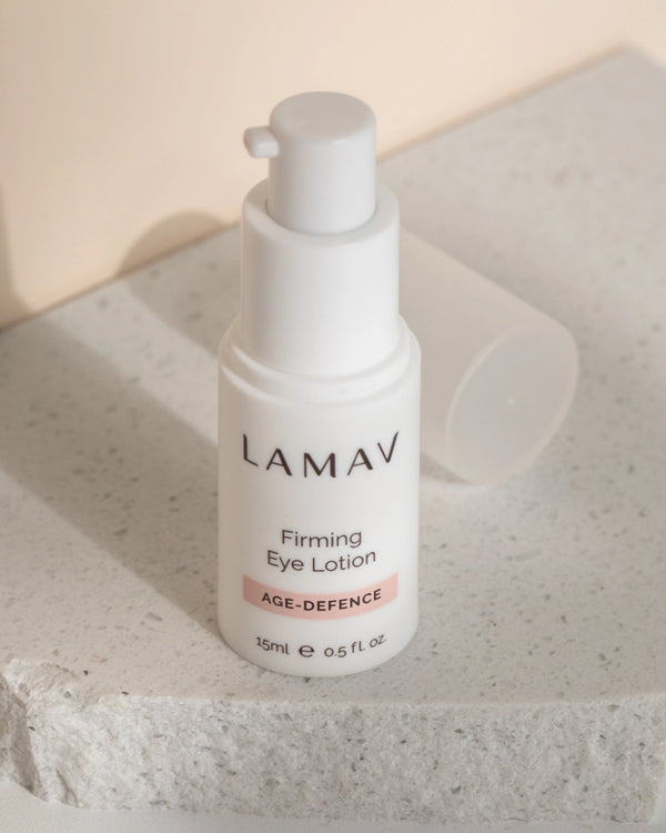 Firming Eye Lotion by LAMAV — 15ml bottle standing on a textured white stone slab | Natural organic age defence