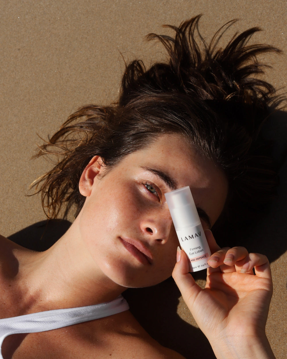 Firming Eye Lotion by LAMAV — white bottle with clean and non-toxic award badges | tightens and lifts eye area
