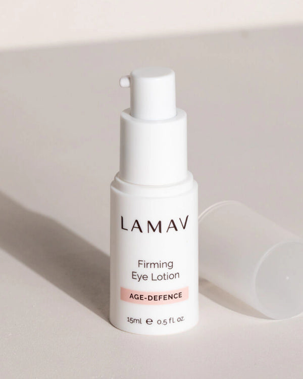 Firming Eye Lotion by LAMAV — white pump bottle standing next to its translucent cap | Fights visible signs of aging