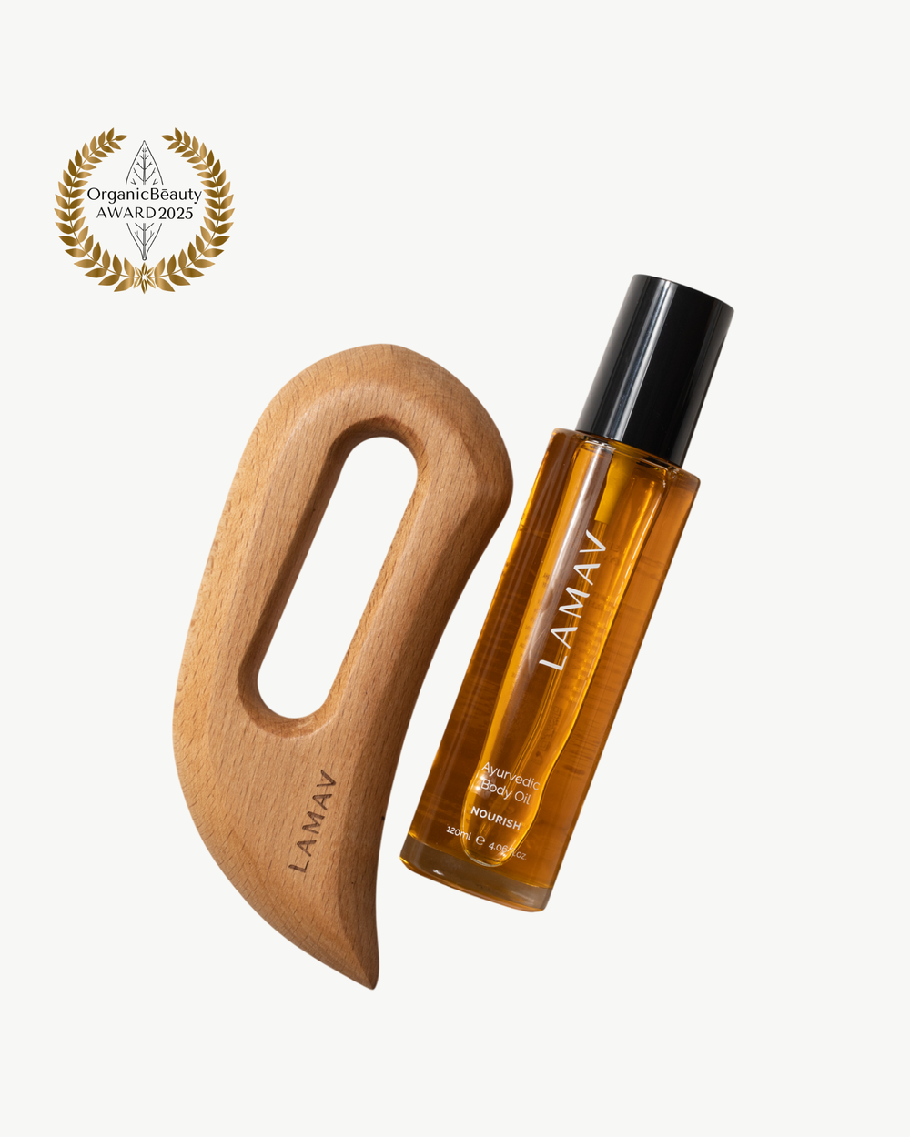 Full Body Bliss by LAMAV — wooden body sculpting tool and Ayurvedic body oil bottle beside award badge | body care set
