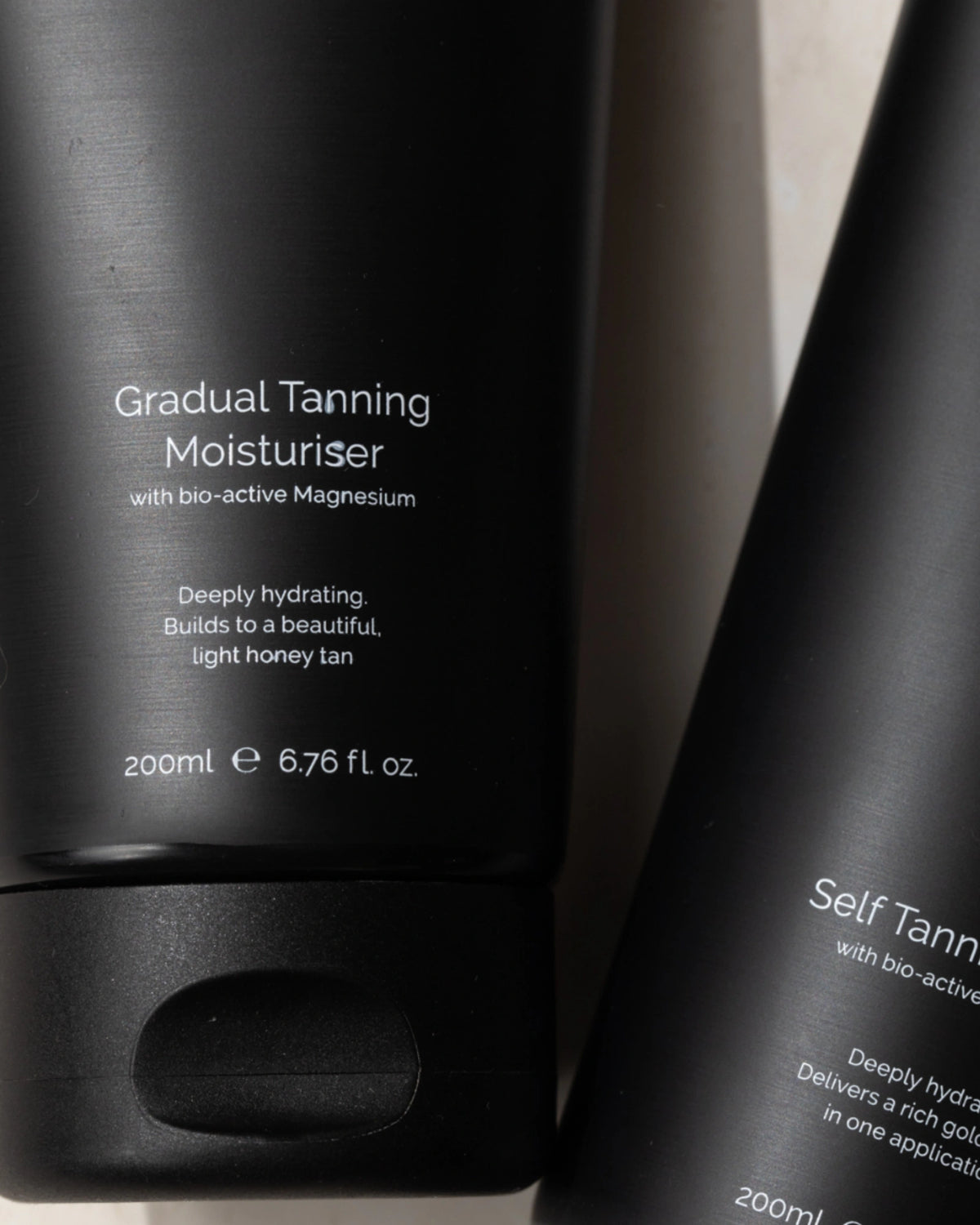 Gradual Tanning Moisturiser by LAMAV — close up of the black tube label text | Enriched with bio-active magnesium