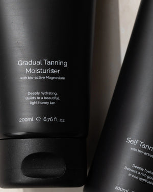 Gradual Tanning Moisturiser by LAMAV — close up of the black tube label text | Enriched with bio-active magnesium