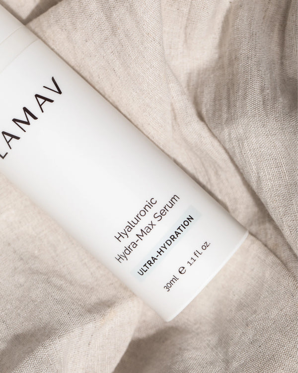Hyaluronic Hydra-Max Serum by LAMAV — white bottle resting on soft linen fabric | Smooths fine lines and wrinkles