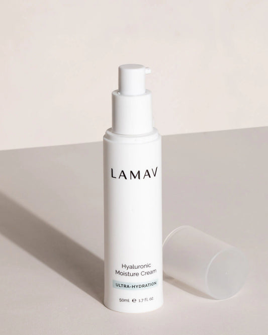 Hyaluronic Moisture Cream by LAMAV — open pump bottle and cap on a grey surface | Delivers intense hydration