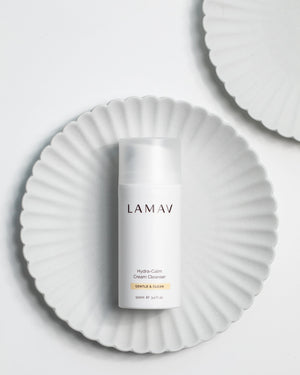 Hydra-Calm Cream Cleanser by LAMAV — 100ml bottle on a white fluted plate | Pure and gentle daily cleanser