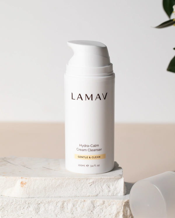 Hydra-Calm Cream Cleanser by LAMAV — 100ml bottle standing on rough white stone blocks | Gentle organic wash